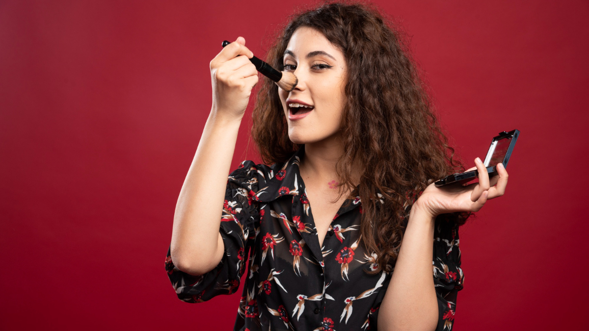dramatic makeup look with glitter eyes and statement blush
