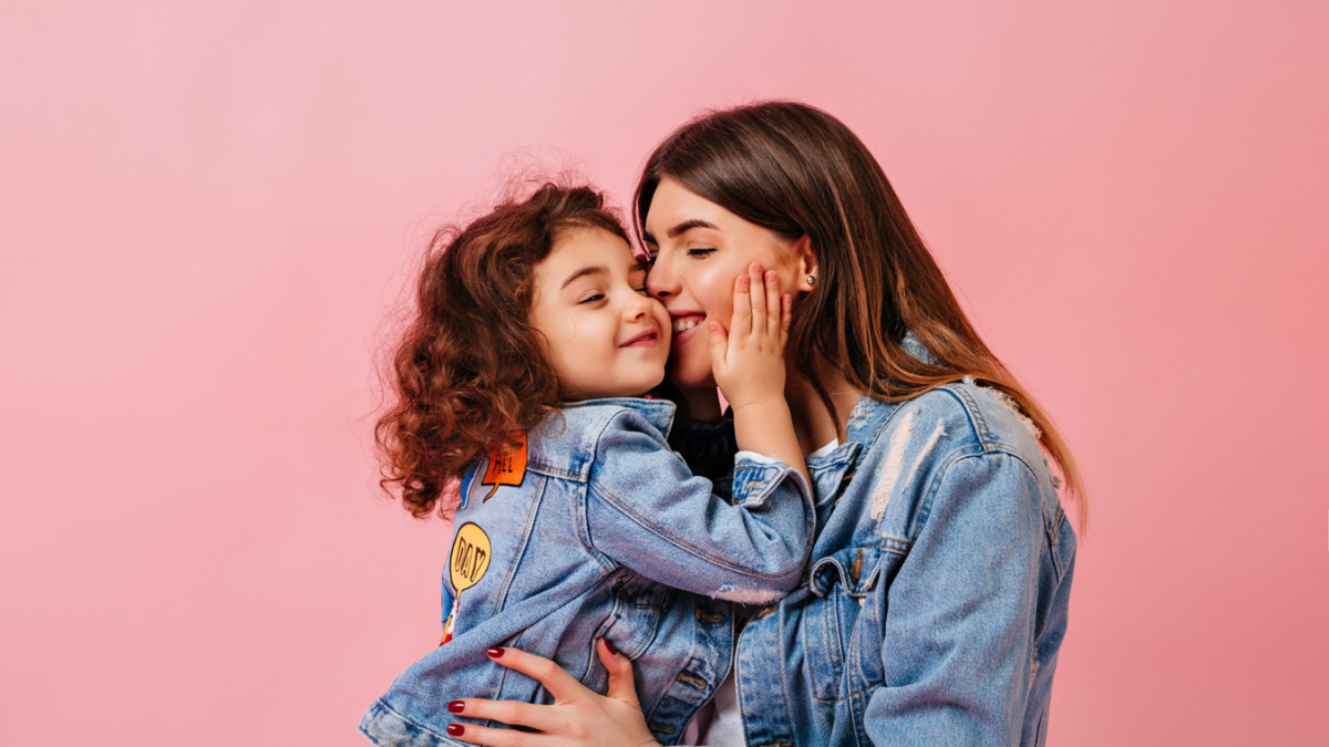 Mother hugging child showing unconditional love and emotional bond