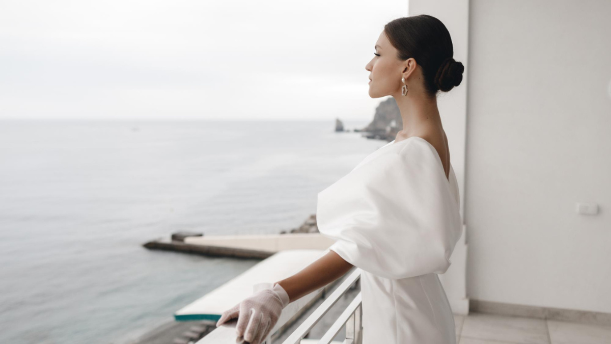 Elegant businesswoman representing abundance mindset and financial freedom in a luxury setting