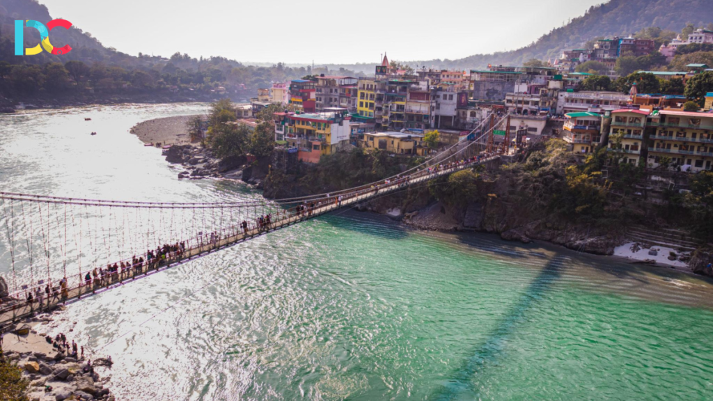 Devotees attending evening Ganga Aarti on the banks of the Ganges in Rishikesh surrounded by glowing lamps and spiritual chants.
