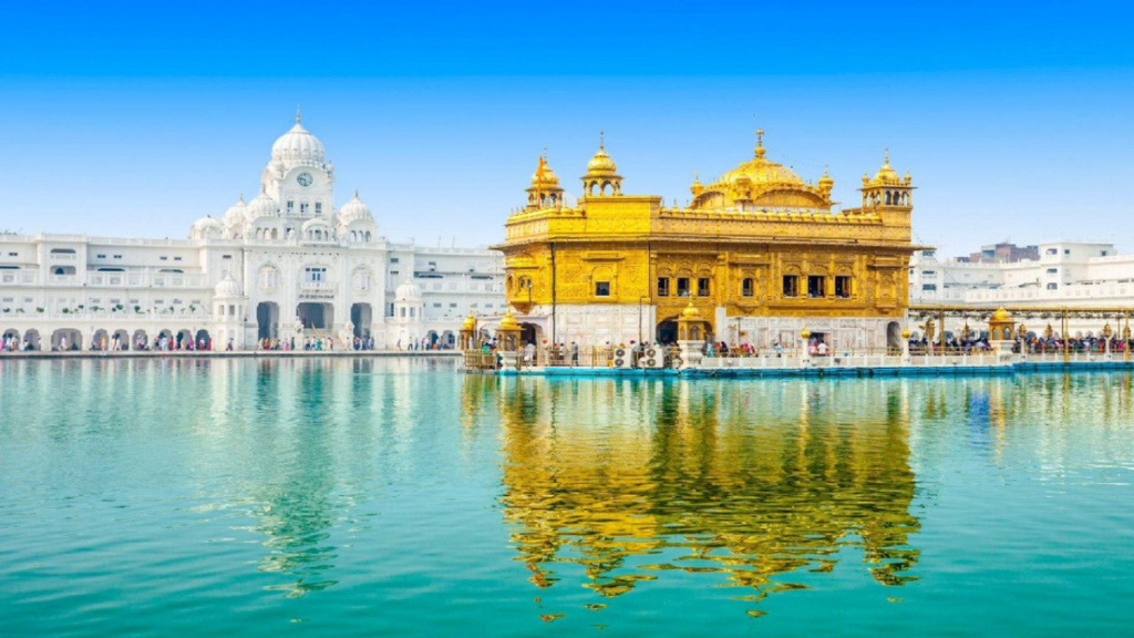 Golden reflections of the sacred Golden Temple surrounded by devotees and the holy sarovar.