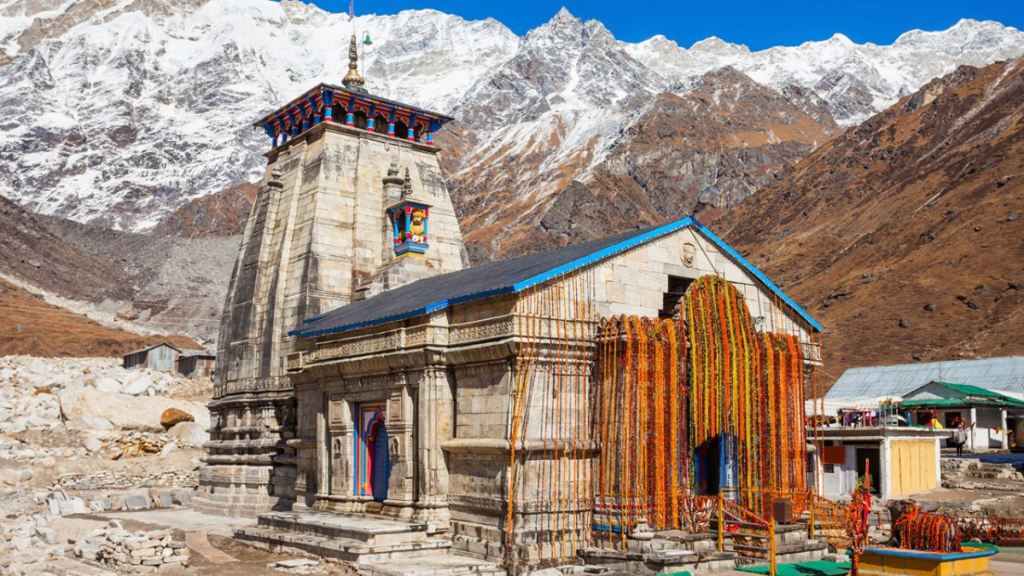 Snow-covered Himalayan landscape surrounding Kedarnath Temple during pilgrimage season.