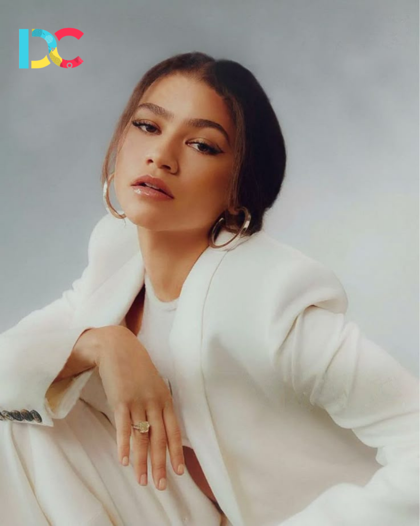Zendaya wearing a luxury couture outfit on a red carpet.