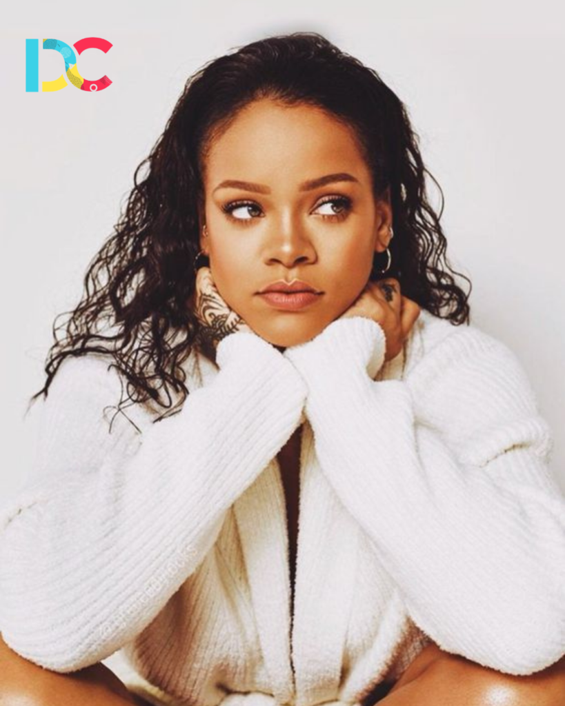 Rihanna in a high-fashion designer ensemble.